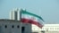 FILE - Bendera Iran di PLTN Bushehr Iran, 10 November 2019. (ATTA KENARE / AFP)