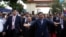 FILE - Prime Minister Hun Sen (center R) and President of the National Assembly Heng Samrin (center L) arrive before a ceremony at the party headquarters in Phnom Penh, January 7, 2017.