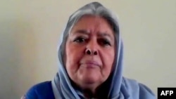 FILE - In this AFPTV screenshot made on Sept. 24, 2021, activist Mahbouba Seraj speaks with Agence France-Presse in Kabul, Afghanistan. She lambasted the global community Feb. 18, 2023, for failing to develop a plan on how to help her country since the Taliban took control of it.