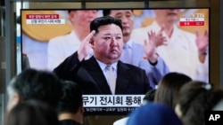 A TV screen shows an image of North Korean leader Kim Jong Un at a military parade to mark the 70th anniversary of the armistice that halted fighting in the 1950-53 Korean War, during a news program at the Seoul Railway Station in Seoul, South Korea, July 28, 2023. 