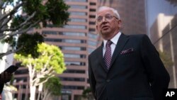 FILE - Attorney John Eastman, the architect of a legal strategy aimed at keeping former President Donald Trump in power, talks to reporters after a hearing in Los Angeles, June 20, 2023.