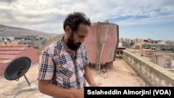 Sami Albah, shown on Sept. 17, 2023, lost his sister, her husband and parents-in-law, and their four children in the flood, in Derna, Libya.