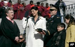 FILE - Nikki Haley takes the oath as Governor of South Carolina, Jan. 12, 2011, at the Statehouse in Columbia, South Carolina.