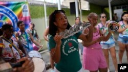 Members of the Turma da Paz de Madureira, or TPM, samba school rehearse in preparation for Rio's Carnival parade, in Rio de Janeiro, Brazil, Saturday, Feb. 4, 2023. (AP Photo/Silvia Izquierdo)