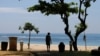 FILE - A tourist enjoys a beach in Nusa Dua, Bali, Indonesia, Nov. 17, 2022. Many East and Southeast Asian nations have launched digital nomad visas that allow remote workers to live and work there. 