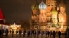 Police and the Rosguardia (National Guard) servicemen walk in Red Square, closed for celebrations on New Year's Eve, with the St. Basil's Cathedral, in Moscow, Dec. 31, 2022. 