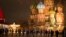 Police and the Rosguardia (National Guard) servicemen walk in Red Square, closed for celebrations on New Year's Eve, with the St. Basil's Cathedral, in Moscow, Dec. 31, 2022. 