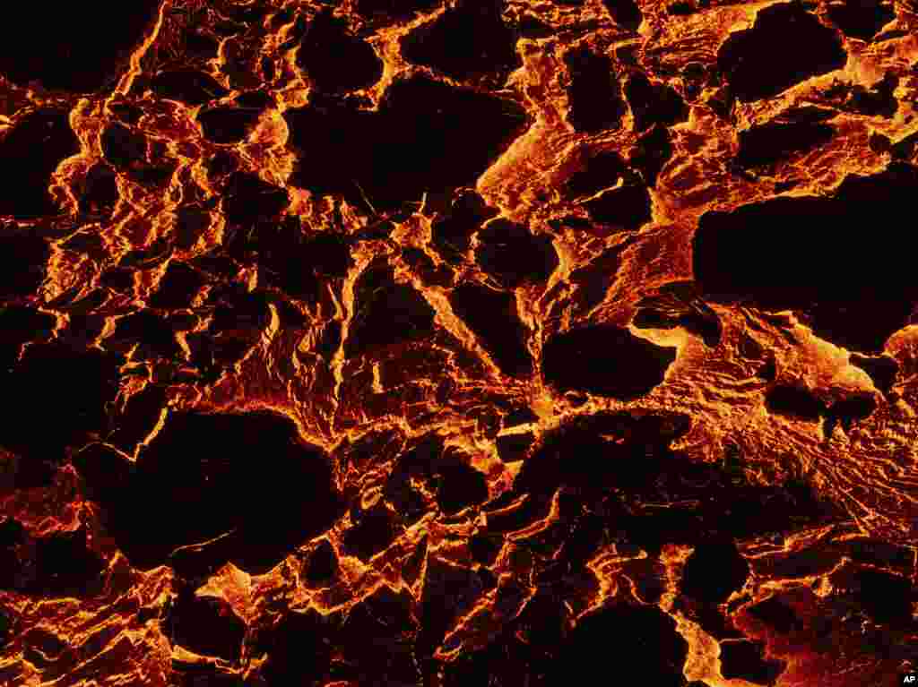 Lava from a volcanic eruption flows near the town of Grindavik, Iceland, March 20, 2024.