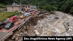 This photo released by Xinhua News Agency, shows the aftermath of a mudslide in northwestern China's Shaanxi province, Aug. 12, 2023.