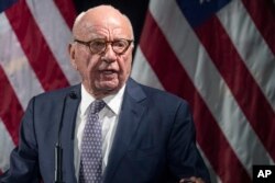 FILE - Rupert Murdoch introduces Secretary of State Mike Pompeo during the Herman Kahn Award Gala, Oct. 30, 2019, in New York.