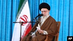 In this picture released by the official website of the office of the Iranian supreme leader, Ayatollah Ali Khamenei speaks during a ceremony commemorating the death anniversary of Ayatollah Khomeini, June 4, 2023. 