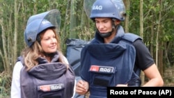 California activist Heidi Kuhn, left, who has worked to remove land mines from war-torn regions and replace them with fruit trees and vegetables, was named the 2023 World Food Prize laureate on May 11, 2023. She is pictured with her son Christian. (Roots of Peace via AP)