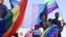 Members of Namibia's LGBTQ community wave rainbow flags during a Pride Parade in the capital Windhoek, July 29, 2017. The country's Supreme Court on March 20, 2023, sided with a lower court in denying a gay couple's citizenship application for foreign-born surrogate child.
