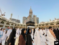 Muslim pilgrims circumambulate around the Kaaba, the cubic building originally built by the Archprophet Abraham, at the Grand Mosque, during the annual hajj pilgrimage in Mecca, Saudi Arabia, June 26, 2023, before heading to Mina in preparation for the Hajj, the fifth pillar of Islam and one of the largest religious gatherings in the world.
