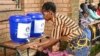 A child has her hands washed at a displacement center in Blantyre, southern Malawi March 16, 2023. 