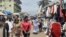 People browse at a market on the side of a road in Libreville on Sept. 2, 2023. Gabon's army said on Sept. 2, 2023, that it would reopen the country's borders, closed in the wake of the military coup that ousted ex-president Ali Bongo Ondimba.