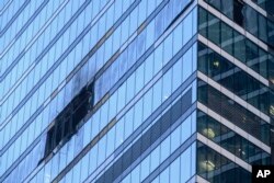 A damaged building is seen in the "Moscow City" business district after a reported drone attack in Moscow, Russia, Aug. 1, 2023. The same building was already attacked by a drone two days earlier.