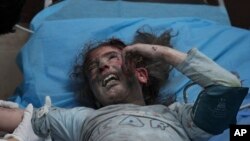 A Palestinian girl, wounded in an Israeli bombardment on the Gaza Strip, cries in a hospital in Deir al-Balah, south of the Gaza Strip, Oct. 21, 2023.