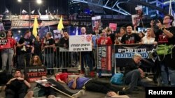 Protesters block a highway demanding the immediate release of hostages who were kidnapped during the deadly Oct. 7 attack, amid the ongoing conflict in Gaza, in Tel Aviv, Israel, May 6, 2024. 