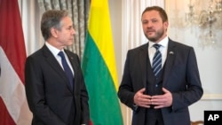 Estonia's Foreign Minister Margus Tsahkna (right) speaks with Secretary of State Antony Blinken on the sidelines of a meeting at the State Department, March 25, 2024, in Washington.