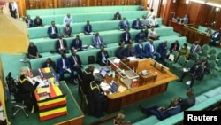 FILE - Members of Parliament weigh the proposal of the Anti-Homosexuality Bill, in Kampala, Uganda, March 9, 2023.