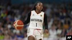 FILE - Alexis Peterson, of Germany, plays against Belgium in a women's basketball game at the 2024 Summer Olympics, in Villeneuve-d'Ascq, France, July 29, 2024.
