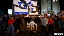 People demonstrate as Israeli Prime Minister Benjamin Netanyahu's nationalist coalition government presses on with its judicial overhaul, in Tel Aviv, Israel, March 25, 2023.