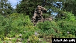 A sculpture of Swedish botanist, zoologist and physician Carl Linnaeus stands in the Heritage Garden of the Chicago Botanic Garden. (AP Photo/Julia Rubin)