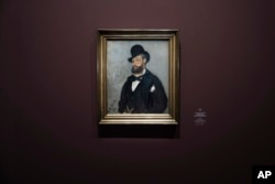 A portrait of Leon Monet by his brother Claude Monet hangs on display as part of an exhibition illuminating the hitherto unknown role Leon played in the role of his brother Claude's life and art, at the Musée du Luxembourg in Paris, Monday, March 13, 2023. (AP Photo/Lewis Joly)