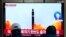 A TV screen shows a file image of North Korea's missile launch during a news program at the Seoul Railway Station in Seoul, South Korea, Feb. 20, 2023. 