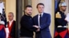 Ukraine's President Volodymyr Zelensky (L) is welcomed by France's President Emmanuel Macron upon his arrival at the Elysee presidential palace in Paris, May 14, 2023.