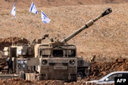 An Israeli army M109 155mm howitzer is deployed at a position along the border with the Gaza Strip near Sderot in southern Israel, Oct. 27, 2023, amid battles between Israel and the Palestinian Hamas movement.