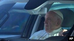 Pope Francis arrives to board his flight to Budapest at Rome's international airport in Fiumicino, Italy, April 28, 2023. 