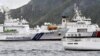 A China Coast Guard vessel sails near a Japan Coast Guard vessel Kabira off Uotsuri Island, one of a group of disputed islands called Senkaku Islands, also known in China as Diaoyu Islands, in the East China Sea, Apr. 27, 2024. (Kyodo/via Reuters) 