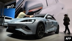 A man polishes a Seal car of Chinese car maker BYD at the International Motor Show (IAA) in Munich, southern Germany, Sept. 4, 2023.