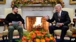 US President Joe Biden and Ukrainian President Volodymyr Zelenskyy meet in the Oval Office of the White House, Dec. 12, 2023, in Washington. 
