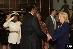 U.S. first lady Jill Biden is welcomed by Namibian President Hage Geingob at the State House in Windhoek, Feb. 23, 2023.