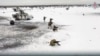FILE - In this handout photo taken from video released by Russian Defense Ministry Press Service on Dec. 28, 2022, Russian soldiers take part in drills at an unspecified location in Belarus.