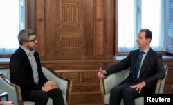 FILE - Syria's President Bashar al-Assad, right, meets with UAE Foreign Minister Sheikh Abdullah bin Zayed bin Sultan al-Nahyan, in Damascus, Syria, Feb. 12, 2023. (Syrian Presidency/Handout via Reuters)