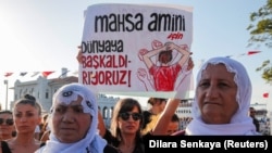 Women take part in a rally on the first anniversary of the death of Mahsa Amini, which prompted protests across the country, in Istanbul, Turkey, Sept. 16, 2023.