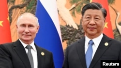 FILE - Russian President Vladimir Putin and Chinese President Xi Jinping pose for a photo during their meeting in Beijing, Oct. 18, 2023.