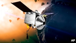 FILE - This illustration provided by NASA depicts the Osiris-Rex spacecraft at the asteroid Bennu. 