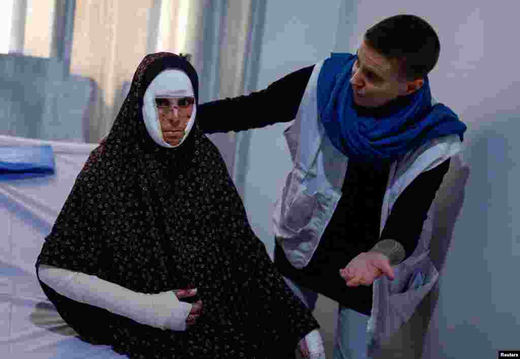 Palestinian Shaima Qarmout, who suffers from burns caused by an Israeli strike, receives treatment provided by Doctors Without Borders, at a hospital in Rafah in the southern Gaza Strip, March 20, 2024. 