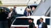 Former President Donald Trump (C) boards his plane at Palm Beach International Airport in West Palm Beach, Florida, April 3, 2023.