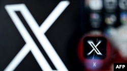 FILE - A photo shows the logo of the online social media and social networking service X — formerly Twitter — on a smartphone screen in Frankfurt am Main, Germany, March 11, 2024.