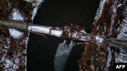 This aerial photograph shows a destroyed bridge in the village of Bohorodychne, Donetsk region on Feb. 21, 2023, amid the Russian invasion of Ukraine.
