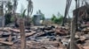 FILE - A destroyed house and burned trees are seen following fighting between Myanmar's military and the Arakan Army ethnic minority armed group in a village in Minbya Township in western Rakhine State, May 21, 2024.