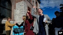 FILE - Youth plaintiffs in the climate change lawsuit, Held vs. Montana, arrive at the Lewis and Clark County Courthouse, June 20, 2023, in Helena, Montana, for the final day of the trial. 