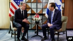 U.S. Secretary of State Antony Blinken, left, meets Israel's President Isaac Herzog in Tel Aviv, Israel, Jan. 9, 2024, during of his weeklong trip aimed at calming tensions across the Middle East.