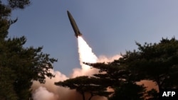 This picture taken May 17, 2024, and released from North Korea's official Korean Central News Agency on May 18 shows a test fire of a tactical ballistic missile toward the East Sea, at an undisclosed location in North Korea.